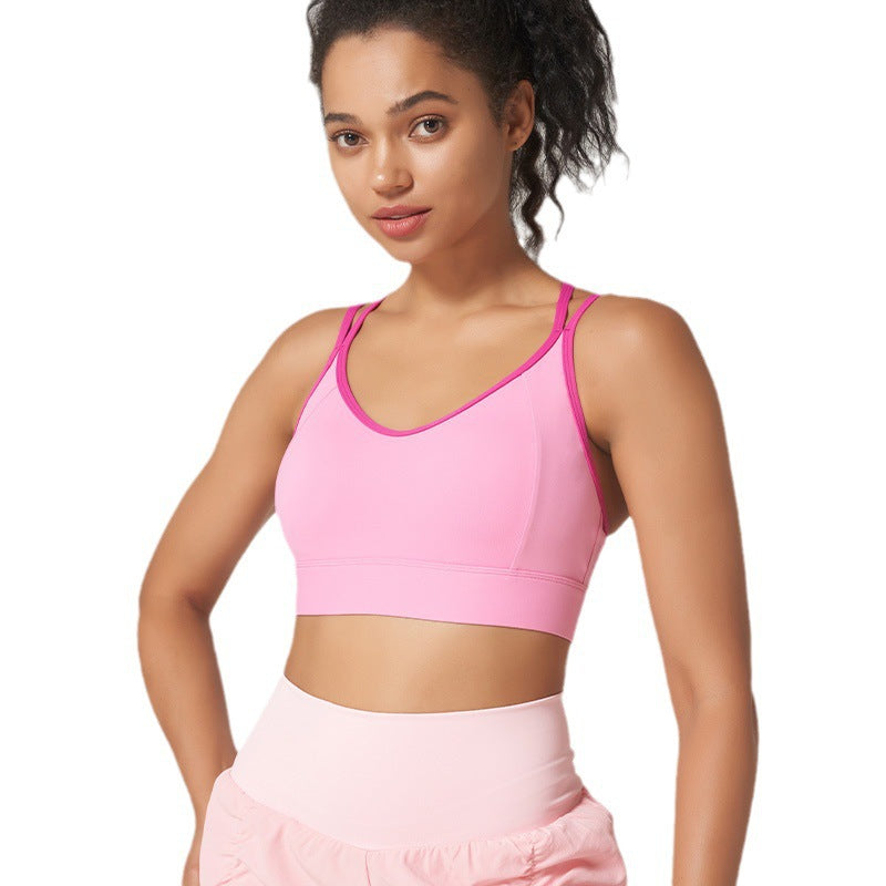 High-support strappy sports bra with beautiful back design. Shockproof, moisture-wicking, perfect for running, fitness, yoga. Available in multiple colors.