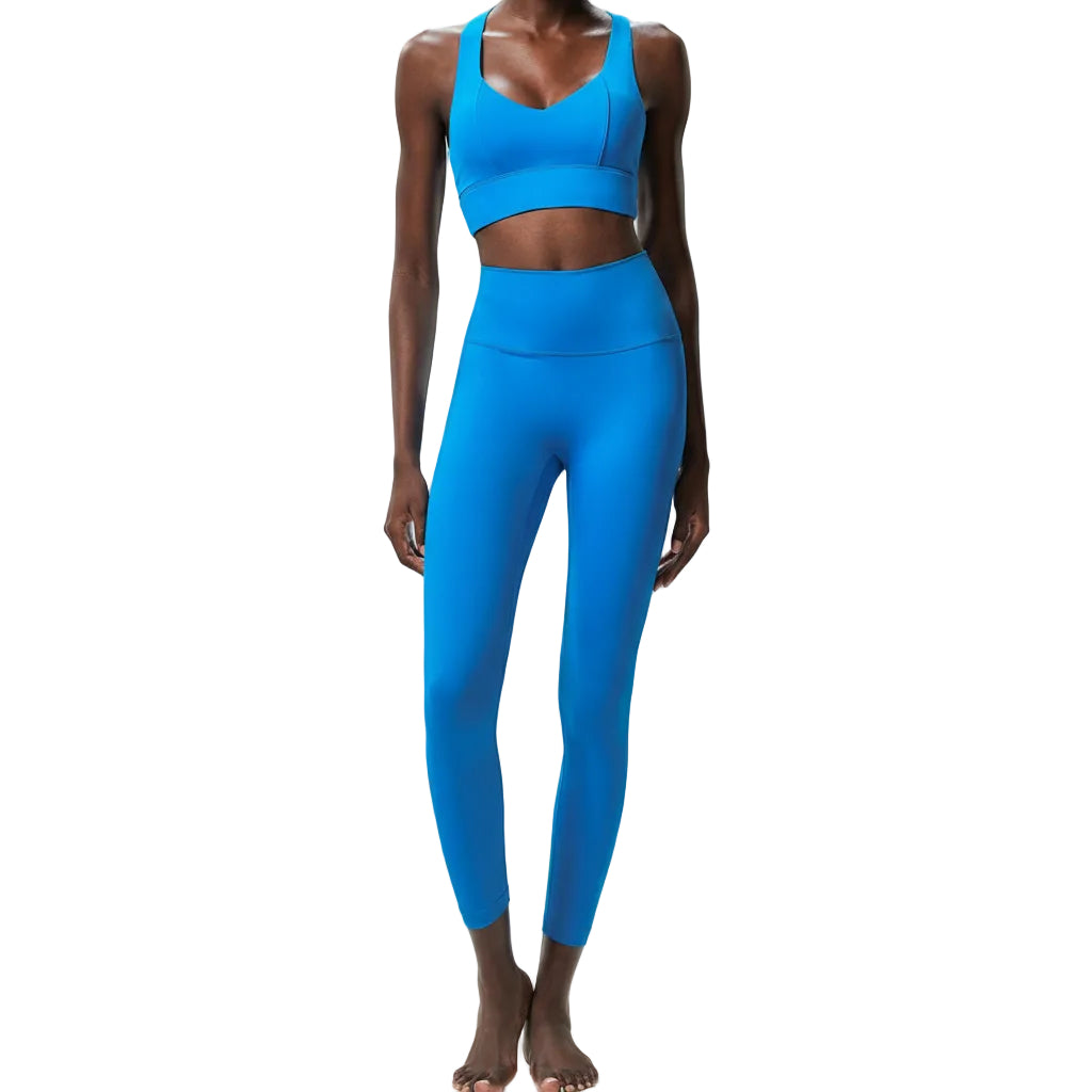 Premium Lycra fitness yoga set with quick-dry technology. Two-piece nude activewear perfect for yoga, running, and fitness training. Superior stretch and support.