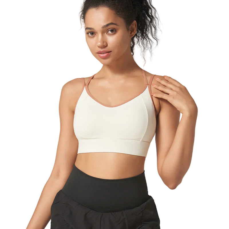 High-support strappy sports bra with beautiful back design. Shockproof, moisture-wicking, perfect for running, fitness, yoga. Available in multiple colors.