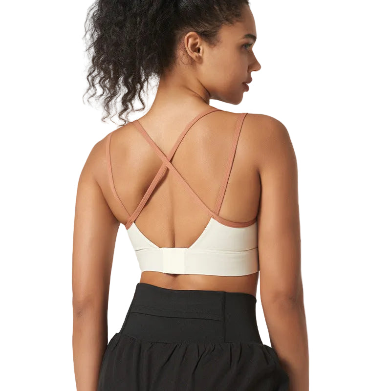 High-support strappy sports bra with beautiful back design. Shockproof, moisture-wicking, perfect for running, fitness, yoga. Available in multiple colors.