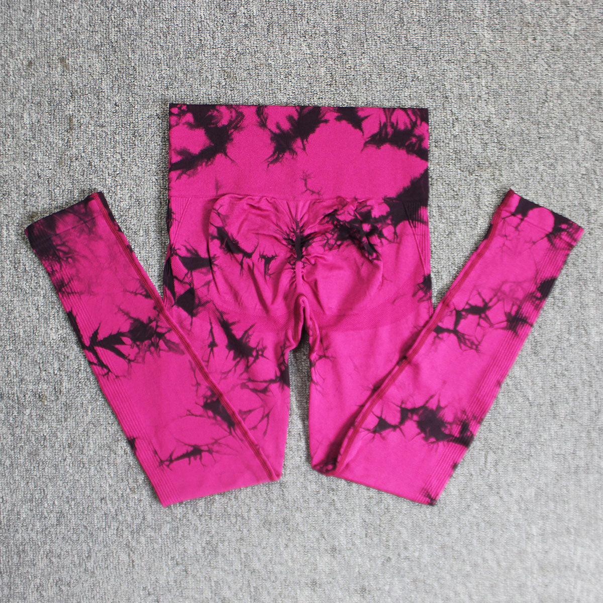 Vibrant seamless tie-dye yoga pants with high waist and peach hip lifting design. High-elastic compression leggings perfect for yoga and fitness.