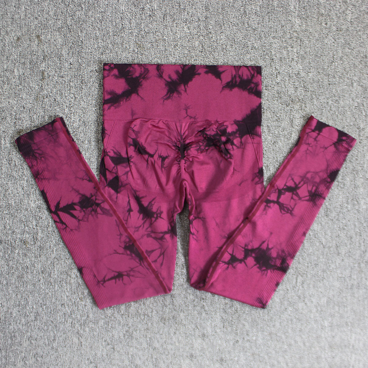 Vibrant seamless tie-dye yoga pants with high waist and peach hip lifting design. High-elastic compression leggings perfect for yoga and fitness.